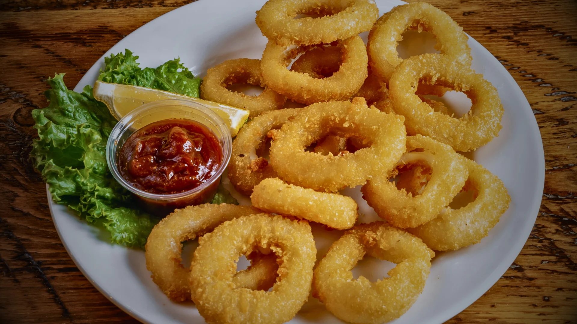 Golden fried calamari with seafood sauce and fresh lemon